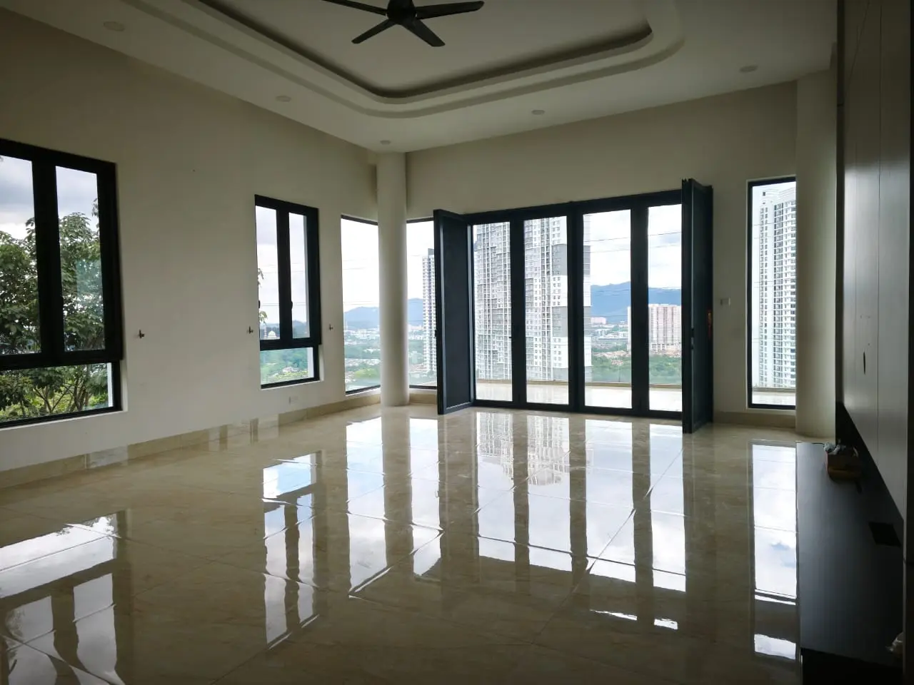 Upper-level lounge with large windows and city views