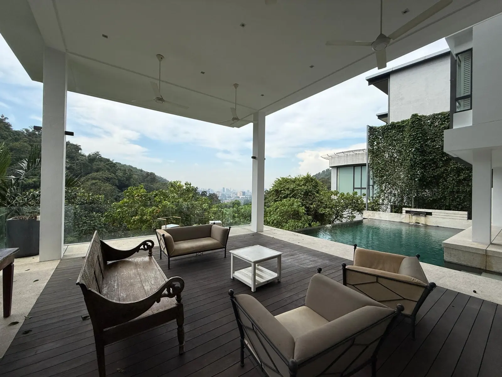 Covered outdoor terrace beside the swimming pool